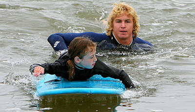 dad and daughter surfing